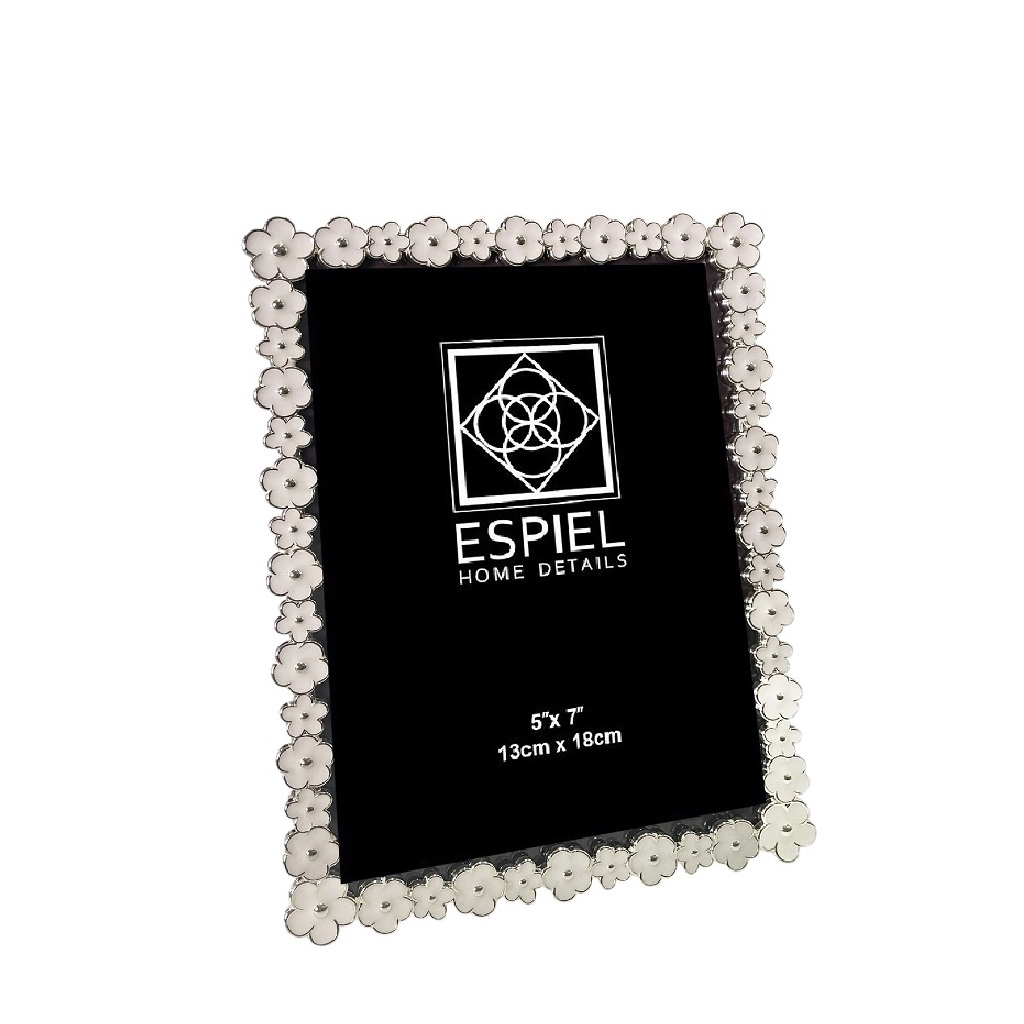 ESPIEL - ΣΗΜΑΝΤΙΚΟ: Σε περίπτωση διαφοράς τιμής από το κατάστημα ισχύει παντα και μόνο η τιμή του καταστήματος Κορνίζα Μεταλλική Ασημί-Λευκή Λουλουδάκι ESPIEL 10x15εκ